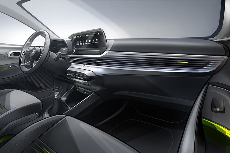 Vom Interieur liegt bisher nur diese Zeichnung vor. Auffällig sind die Luftduschen, das Vierspeichen-Lenkrad und das Festhalten an einer manuellen Handbremse. Beide Monitore sind 10,25 Zoll groß